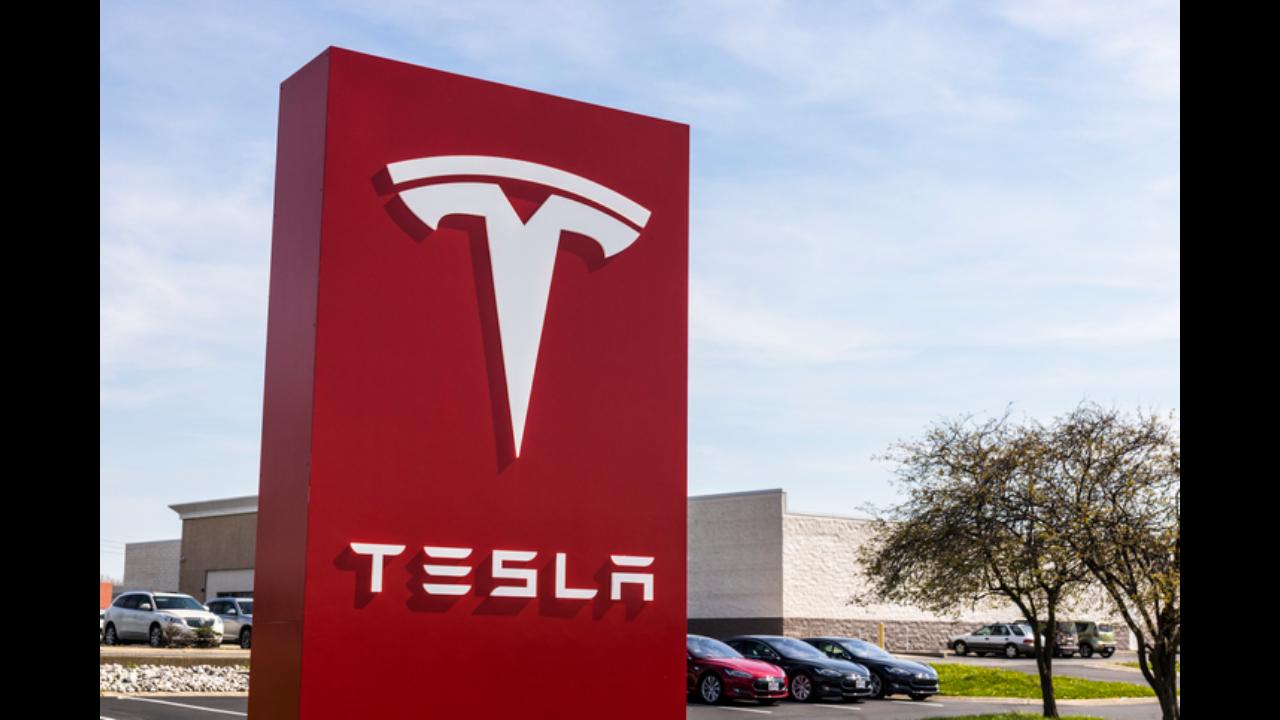 Tesla to disable game feature 'Passenger Play' for drivers, passengers while driving