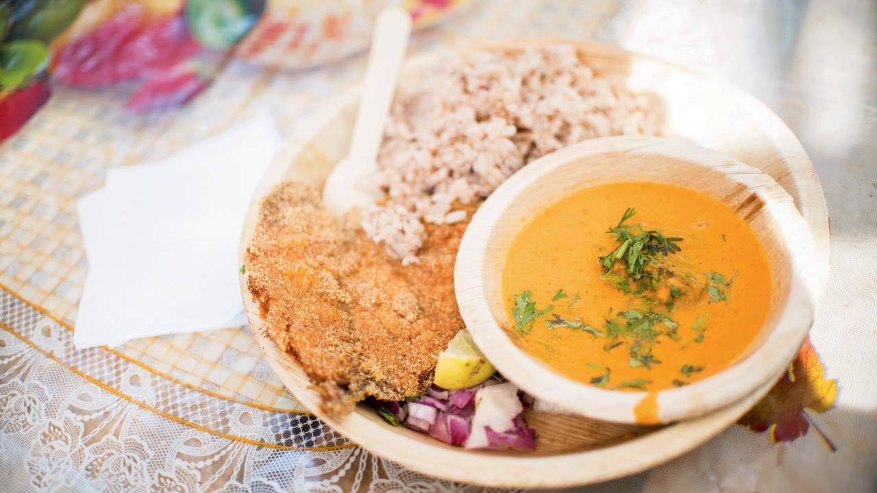 A traditional coastal meal comprising rice, fish and spiced coconut curry