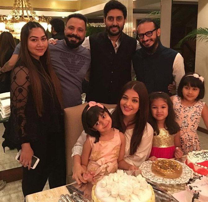 Aishwarya Rai Bachchan with daughter Aaradhya, hubby Abhishek Bachchan and friends at a party.