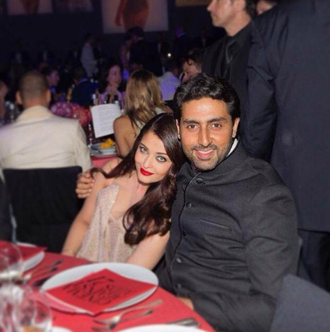 Abhishek Bachchan poses with wife Aishwarya Rai Bachchan for this photo at a party.