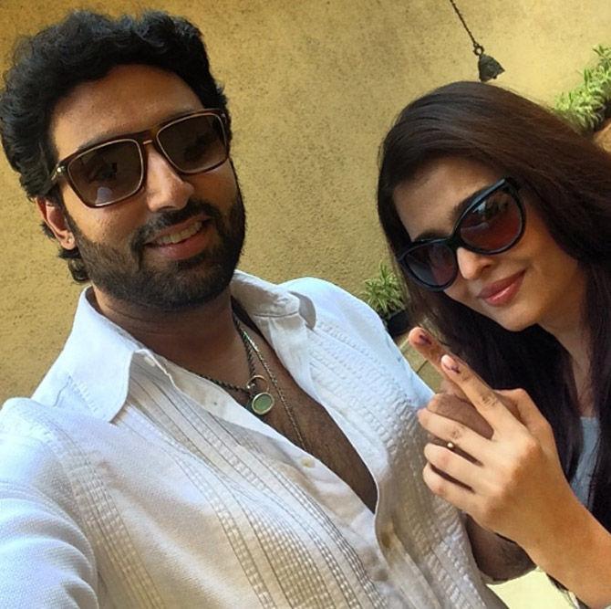 Abhishek Bachchan with wife Aishwarya Rai Bachchan after they cast their vote during elections.