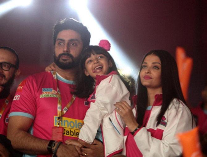 Aishwarya Rai Bachchan and Abhishek Bachchan with daughter Aaradhya at a Pro Kabaddi League match.