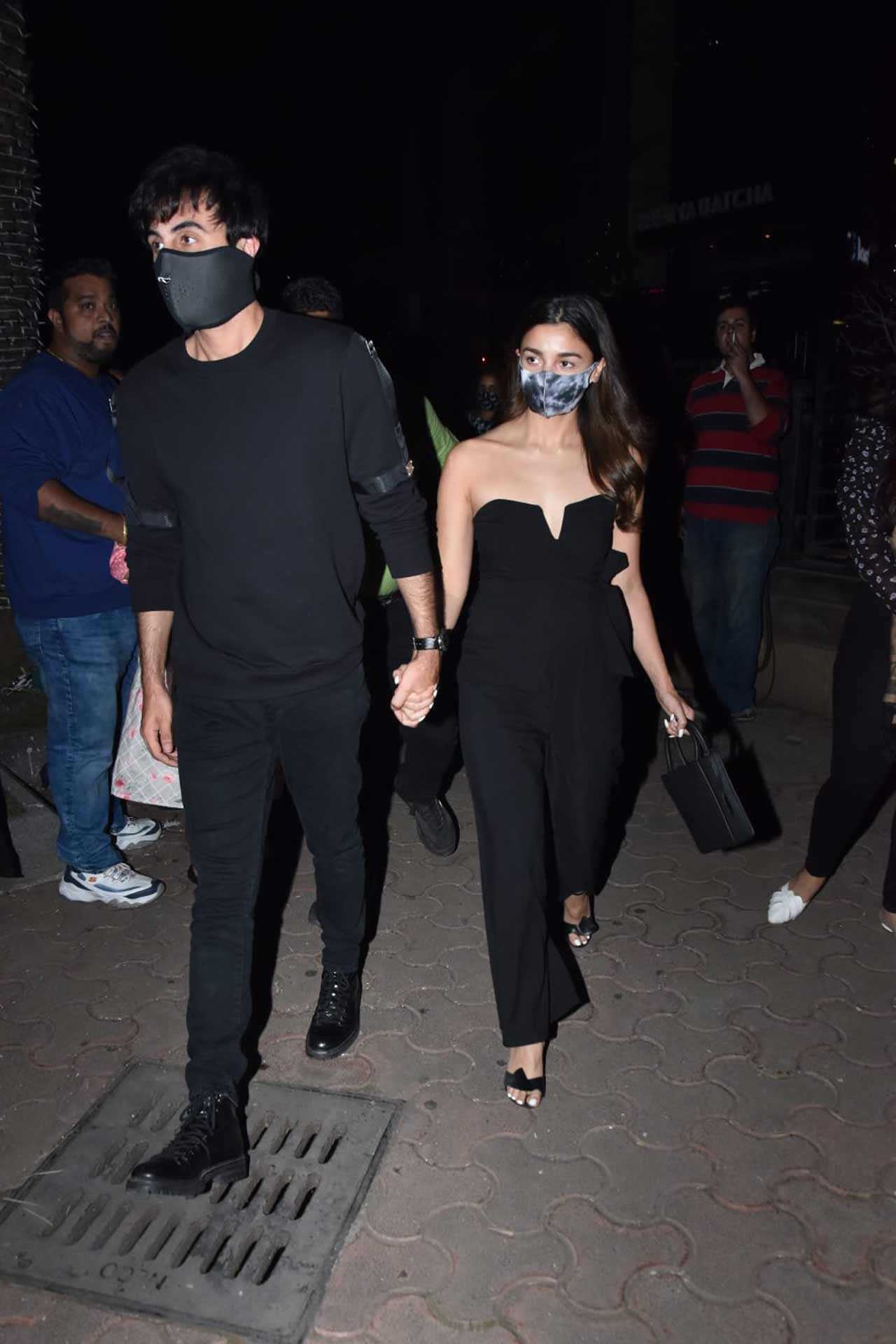 Alia Bhatt and Ranbir Kapoor walked hand-in-hand when snapped by the paparazzi celebrating Rohit's special day. Alia opted for a black jumpsuit for the party whereas Ranbir donned a casual black t-shirt, paired with black coloured pants for the outing.