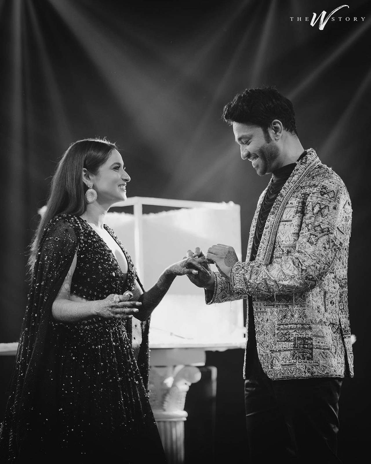 Ankita Lokhande can be seen decked up in a glittery black ensemble. Her smile reflected all her excitement and happiness. Both of them can be seen hugging each other and sharing the most precious moments with their fans by showing their rings to them.