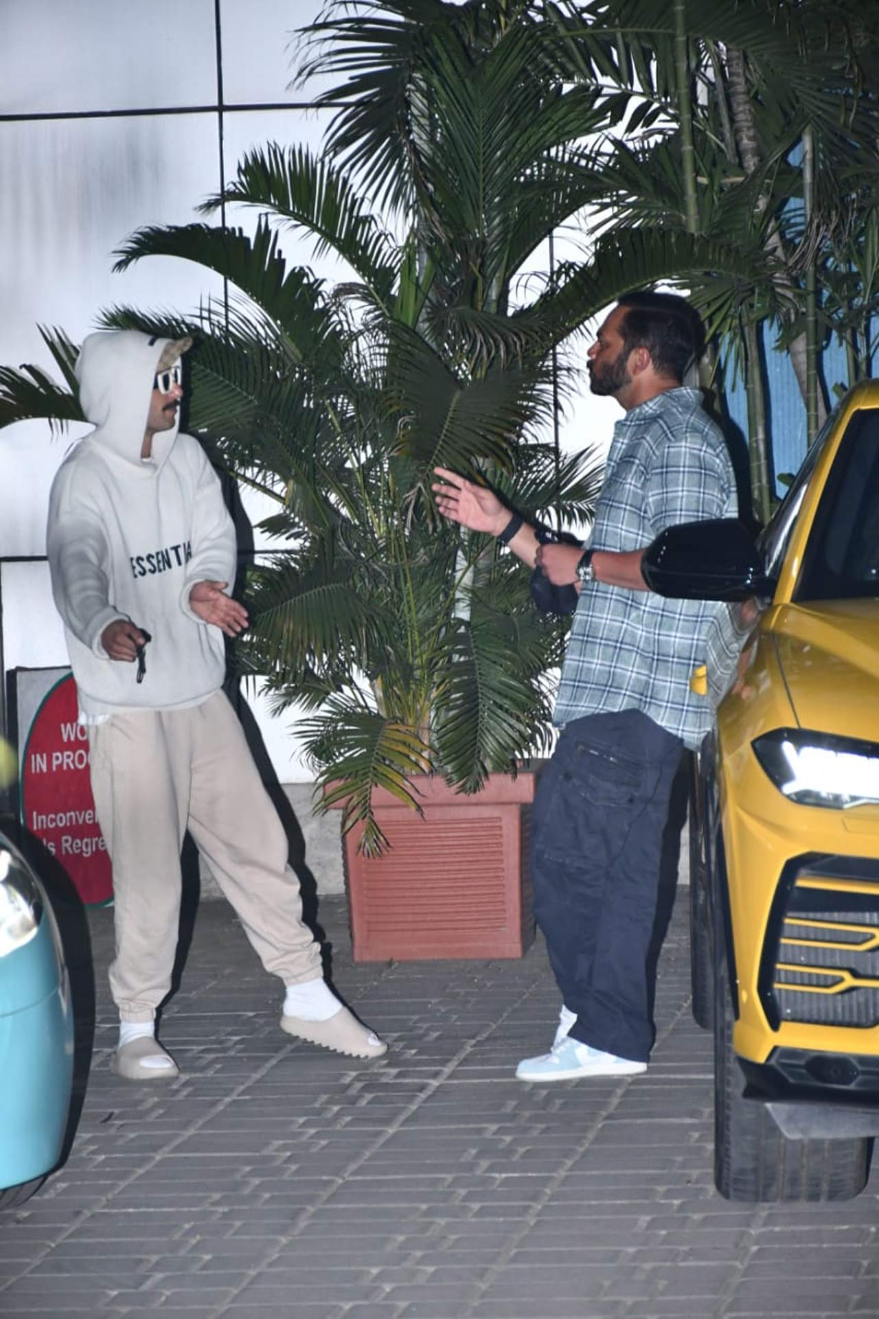Ranveer Singh was clicked once again off guard as he was seen discussing something with Rohit Shetty at the Mumbai airport. Are they planning which car to blow next in their new project? Well, only time can tell!
