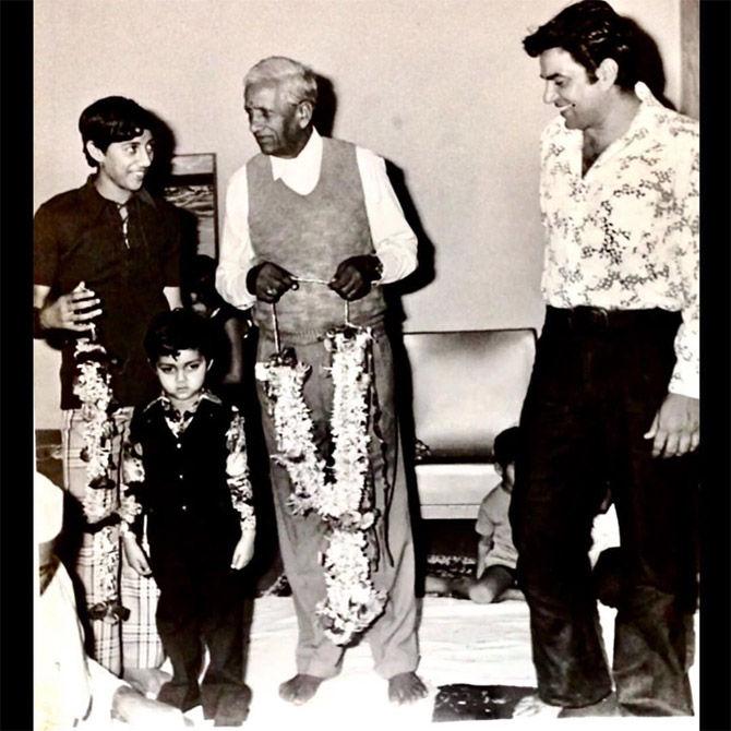 A young Dharmendra with his father Kewal Kishan Singh Deol and sons - Sunny and Bobby.