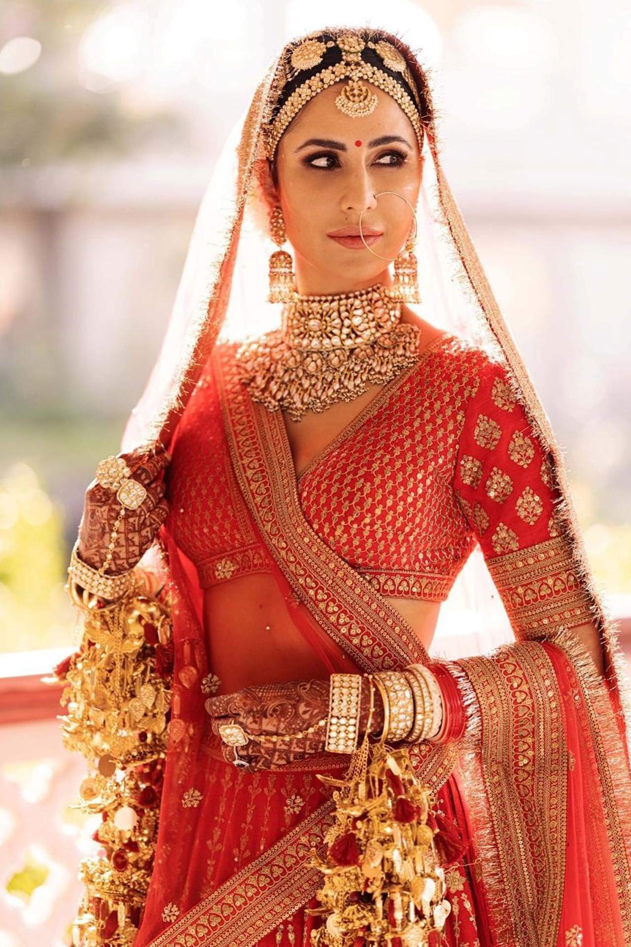 Katrina Kaif walked down the aisle looking breathtakingly beautiful. She looks no less than a royal princess on her wedding day, and we can't get over her red lehenga she opted for the ceremony.