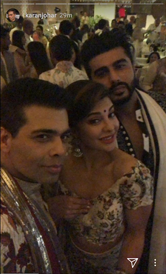 Karan Johar, Jacqueline Fernandez and Arjun Kapoor pose for a picture during the sangeet ceremony of Sonam Kapoor and Anand Ahuja.