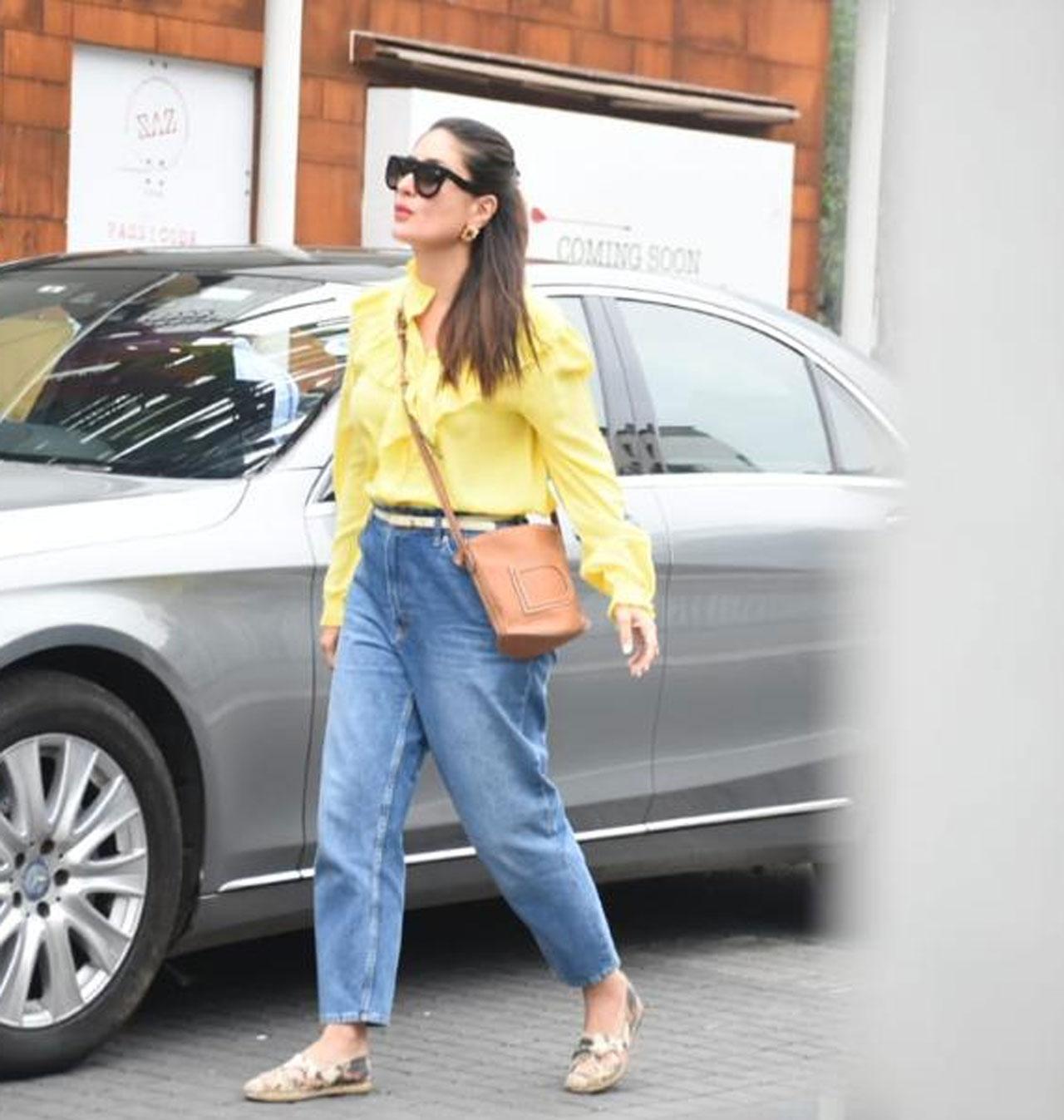 Kareena Kapoor Khan was recently spotted at Bandra Kurla Complex in the city at a toy store. The actress opted for a bright yellow shirt, a pair of blue jeans and shades to complete her look for the day.