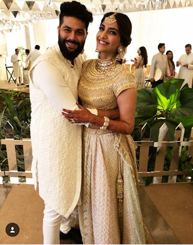 Kunal Rawal poses with the Sonam Kapoor during the sangeet ceremony.