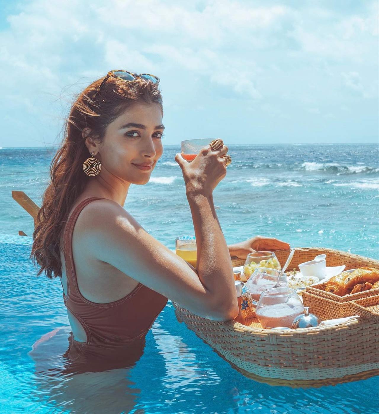 Mouni Roy too opted for a beach vacation but this time it wasn't the Maldives, but Dubai. The actress, who was stuck in the country due to pandemic, is often seen travelling to UAE, chilling as she takes some time off from her busy schedule. Dressing in an orange bikini, she opted for a velvet wraparound during one of her vacations.
