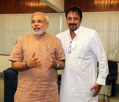 This handout photograph released by the Gujarat Information Bureau shows Narendra Modi (then Gujarat Chief Minister) and Bollywood actor Sanjay Dutt at the Chief Minister's office in Gandhinagar on May 17, 2010. Dutt met Modi with a proposal to set up a film city project in Gujarat.