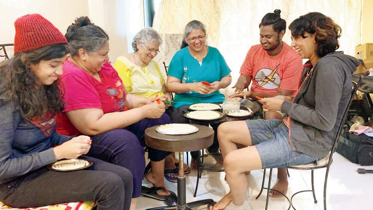 Three generations of the Fernandes’ family prepare kuswar