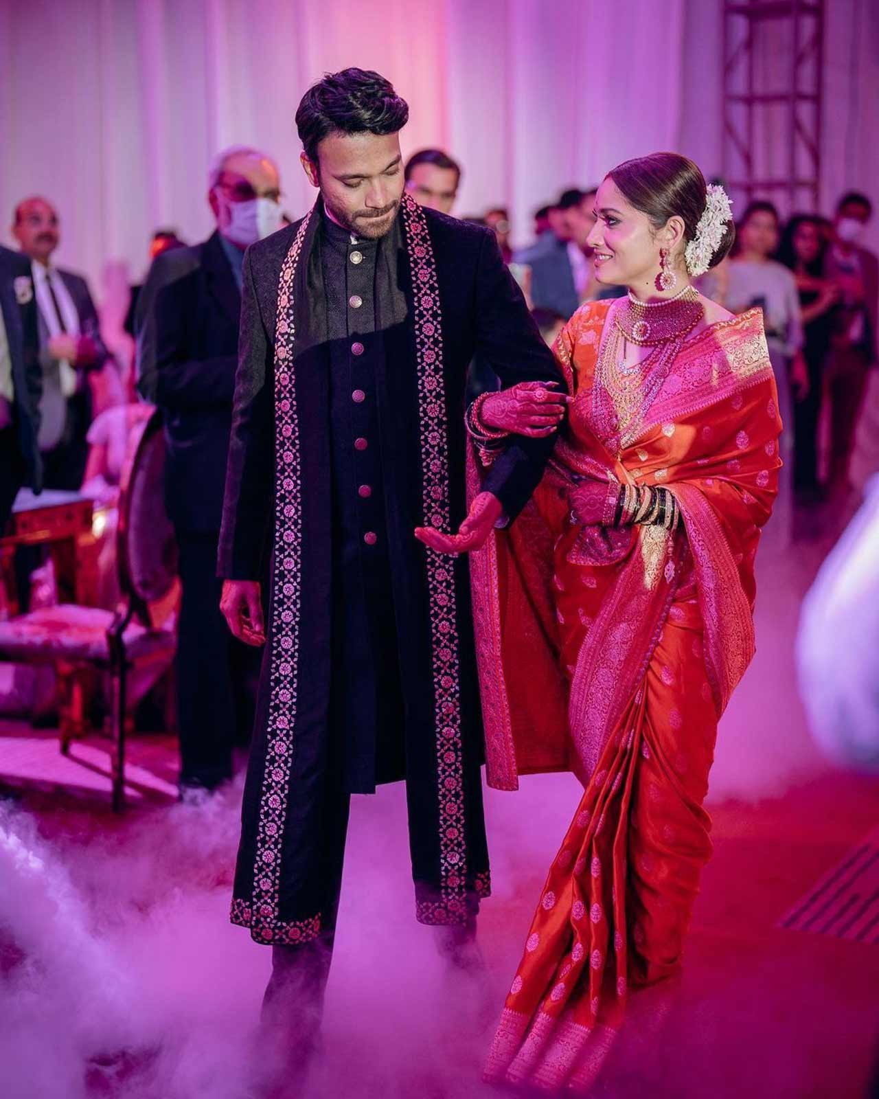 Ankita Lokhande and Vicky Jain shared pictures from their reception ceremony, and they look every bit royal! Dressed in a red Sabyasachi saree, Ankita looked ethereal in her ensemble.
