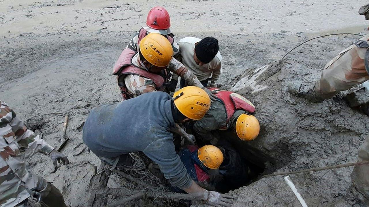 ITBP members during a rescue operation after glacier burst at Reni village in Chamoli district of Uttarakhand. Pic/PTI