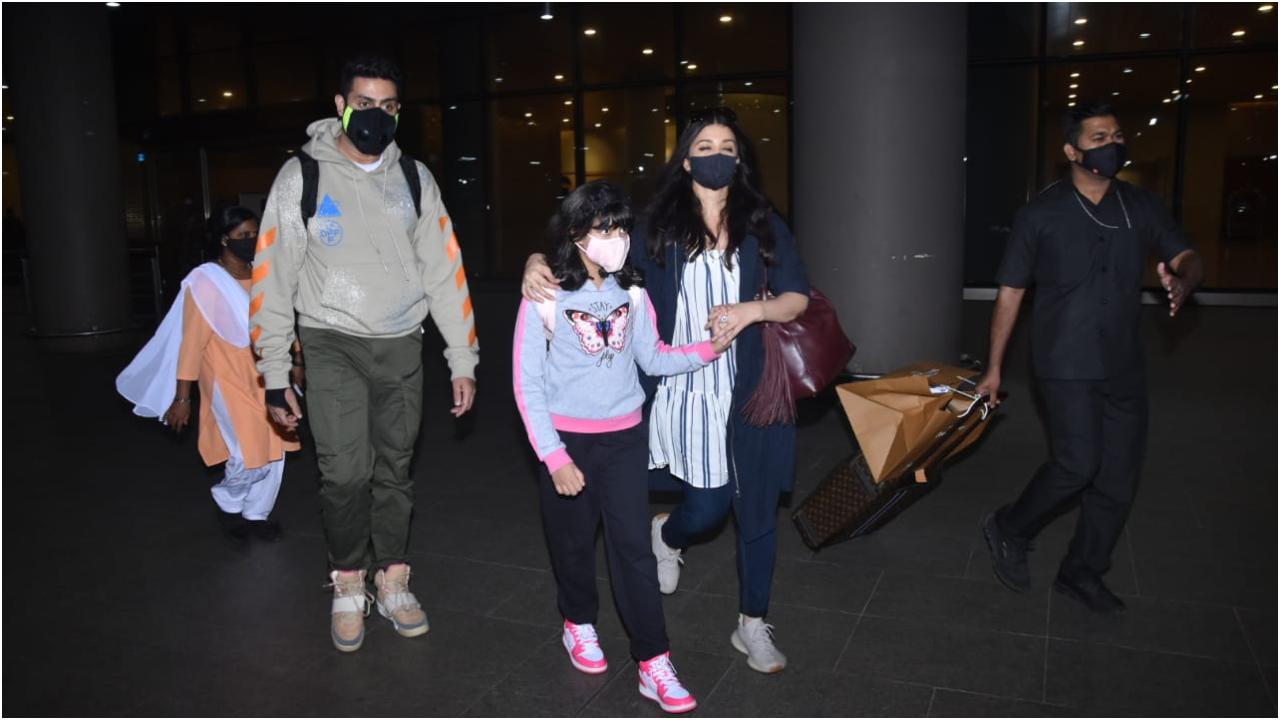 It was a family time for the Bachchans! Aishwarya Rai Bachchan along with her husband Abhishek Bachchan and daughter Aaradhya Bachchan were snapped at the Mumbai Airport. (All pictures: Yogen Shah).