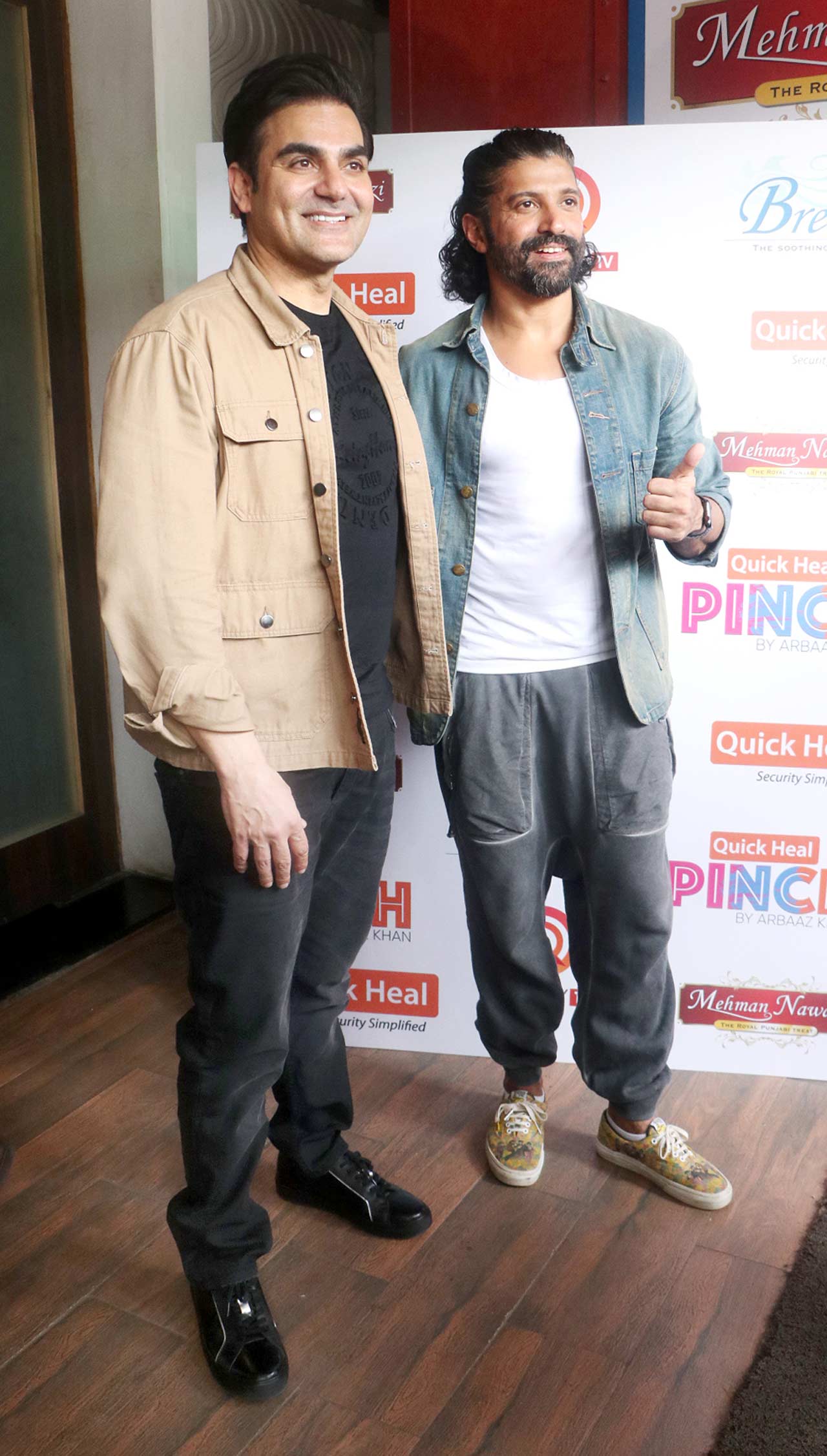 Arbaaz Khan and Farhan Akhtar happily posed for the paparazzi. Arbaaz sported a black t-shirt, pant and brown jacket, while Farhan opted for a white t-shirt and blue jacket.