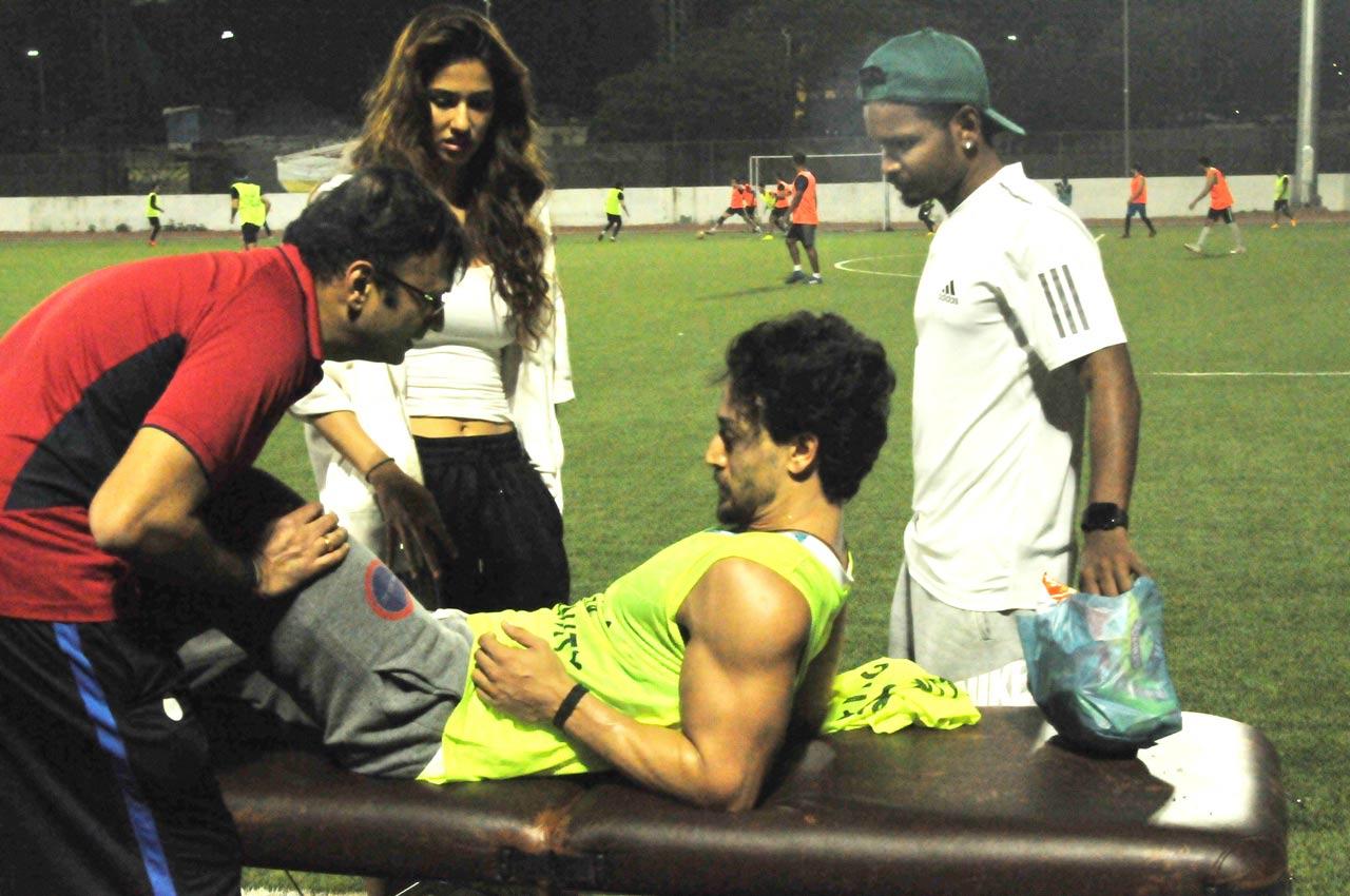 Here’s the picture that shows Tiger Shroff hurt and Disha Patani worried. Shroff is known to be seamless in action and dance. His next film is a franchise called Ganapath that reunites him with his first co-star Kriti Sanon. He also has Heropanti 2 coming up. Hope he gets well soon.
 