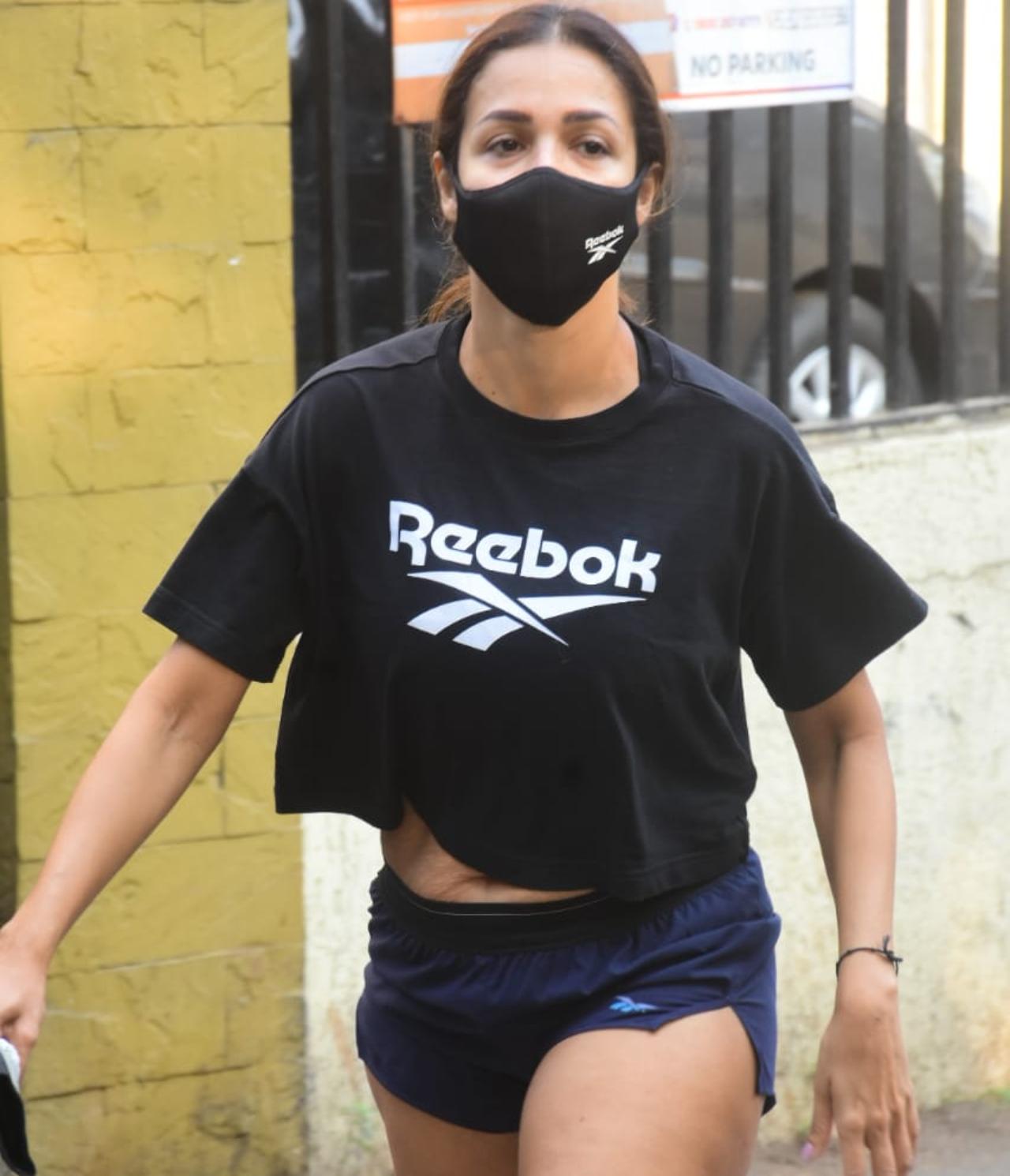 Malaika Arora and her pictures from gym outings are rare to miss. The diva was snapped burning out her calories at her dance class in Bandra, Mumbai. The actress looked gorgeous in her black crop top and blue shorts that showed off her toned legs. (All pictures: Yogen Shah).