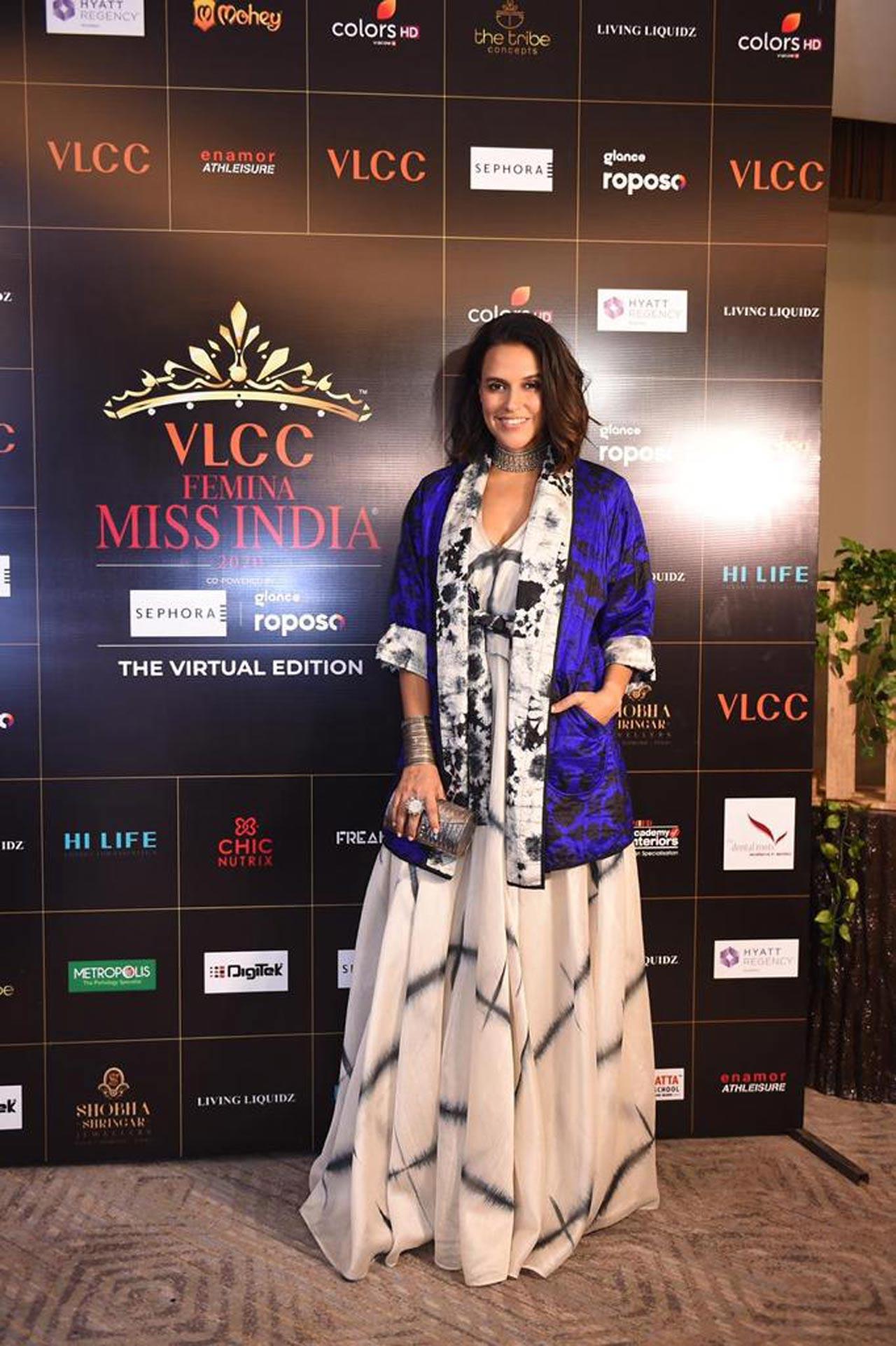 Neha Dhupia opted for a flowy white dress, paired it with chic cobalt blue jacket as she attended the event hosted in Mumbai. Photo courtesy: Pallav Paliwal