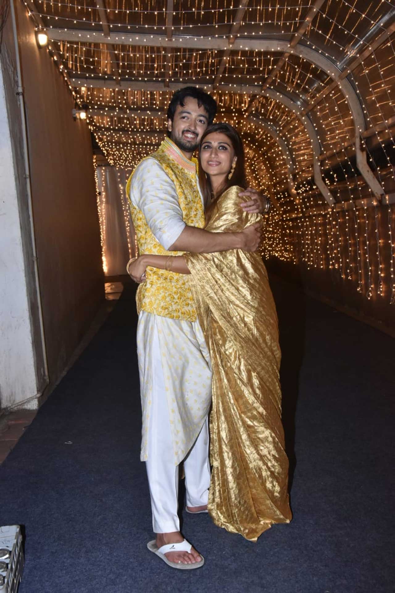 Priyaank K Sharma and Shaza Morani posed for the paparazzi after their wedding ceremony hosted in the city. Priyaank showed off his uber-cool side in a yellow Nehru jacket, paired with a white kurta-pyjama. Shaza Morani flaunted her million-dollar smile wearing a pretty golden saree she opted for the special day.