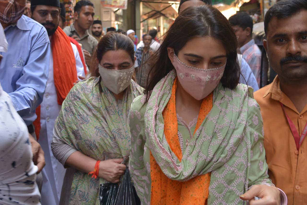 Sara and Amrita opted for a traditional green salwar kameez. Sara wrapped an orange cloth around her neck and wore a pink mask to prevent the spread of COVID-19. 