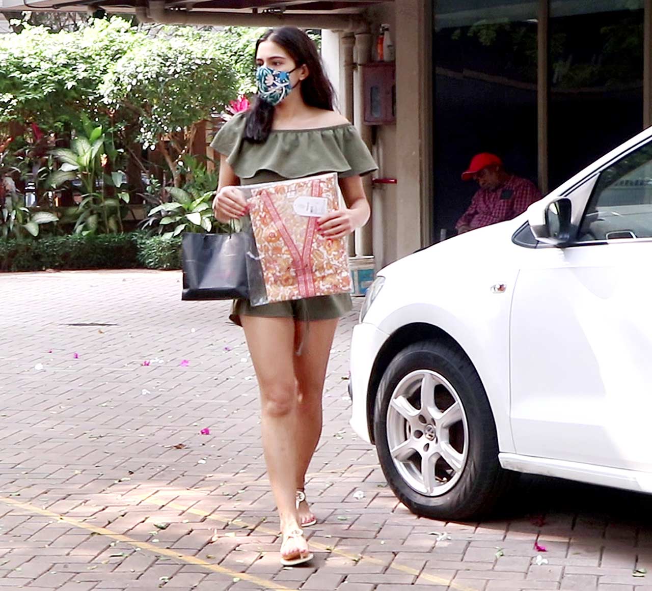 Sara Ali Khan sizzled in her green crop top and shorts. She completed her look with a black handbag.