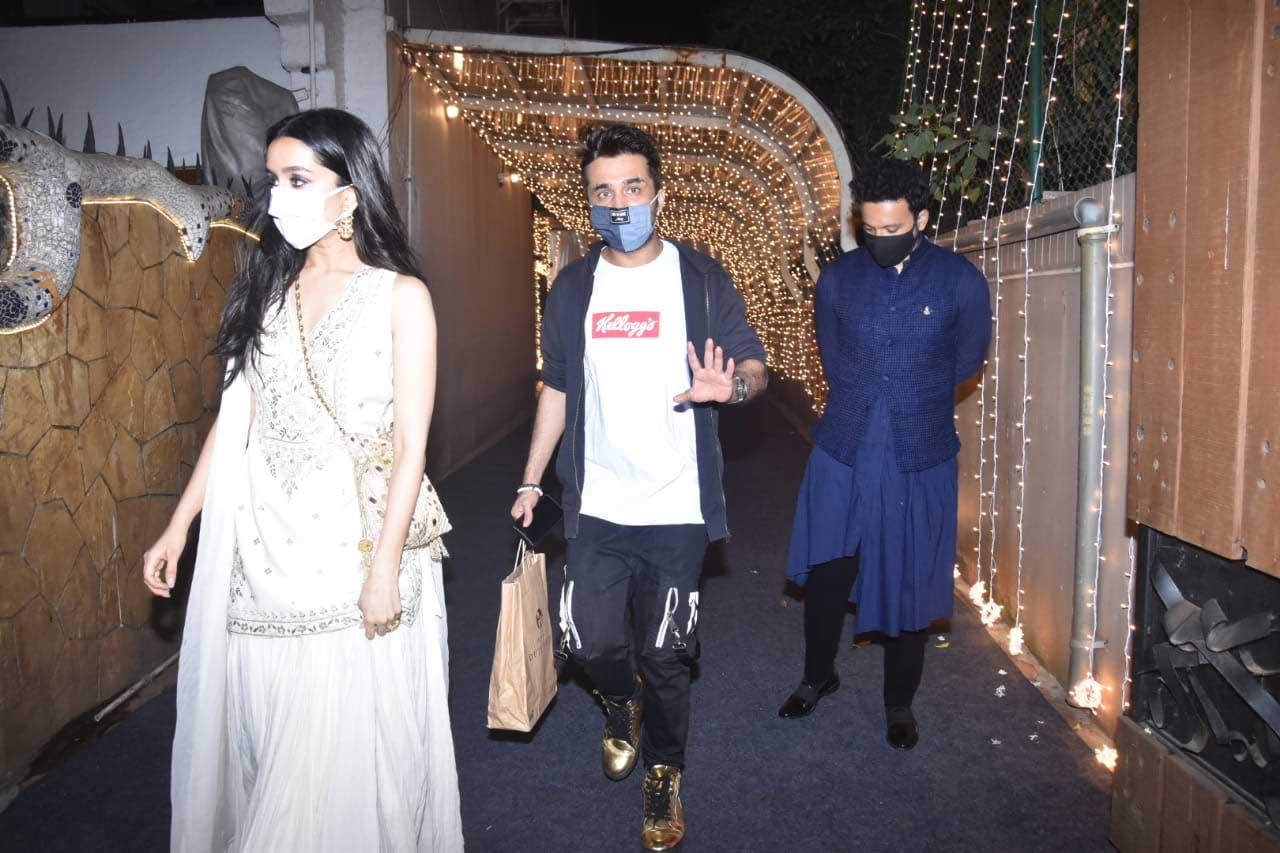Shraddha Kapoor, Siddhanth Kapoor and Rohan Shreshtha walked in together as they attended Priyaank K Sharma and Shaza Morani's wedding ceremony hosted in Juhu, Mumbai. Shraddha stunned in a pretty white ethnic wear as she attended the function. While Siddhanth sported a casual outfit to attend cousin's wedding, Rohan showed off his dapper side in an asymmetrical jodhpuri set.