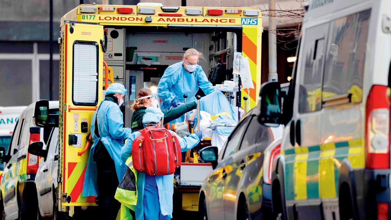 Hospitals swamped, UK mulls moving patients into hotels