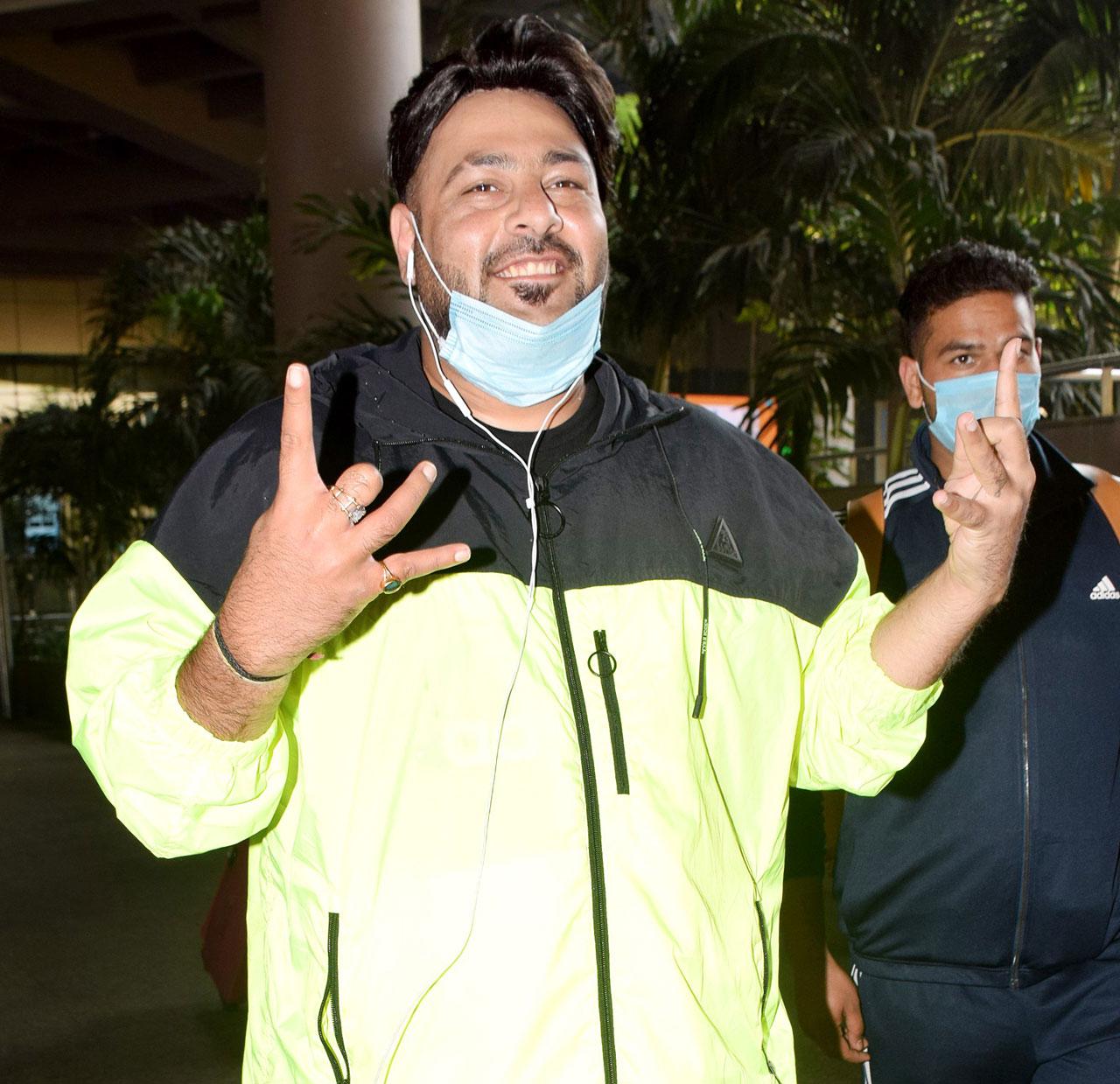 Rapper and music producer Badshah posed happily for the photographers as he arrived at the Mumbai airport.