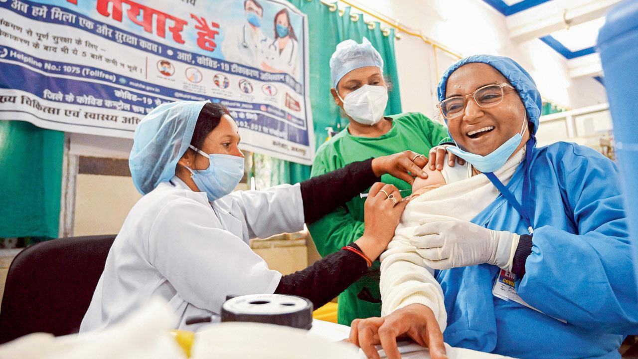 Healthcare workers get first jabs as India's vaccination drive begins