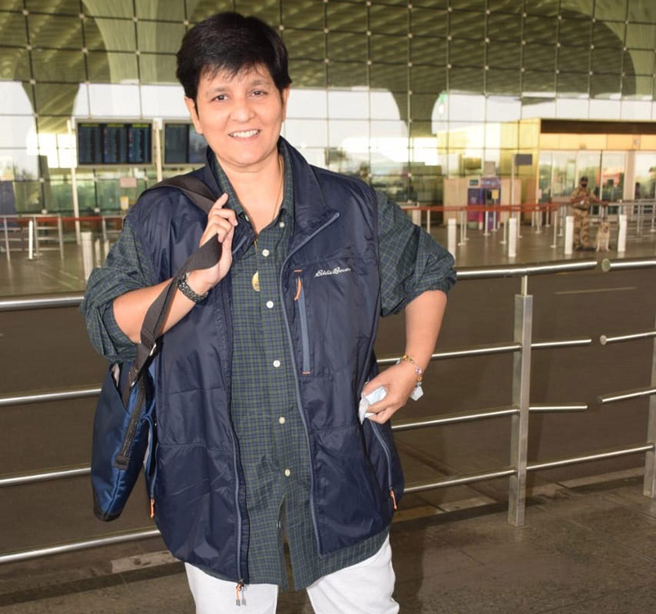 Dandiya queen Falguni Pathak was all smile as she was spotted at the Mumbai airport.