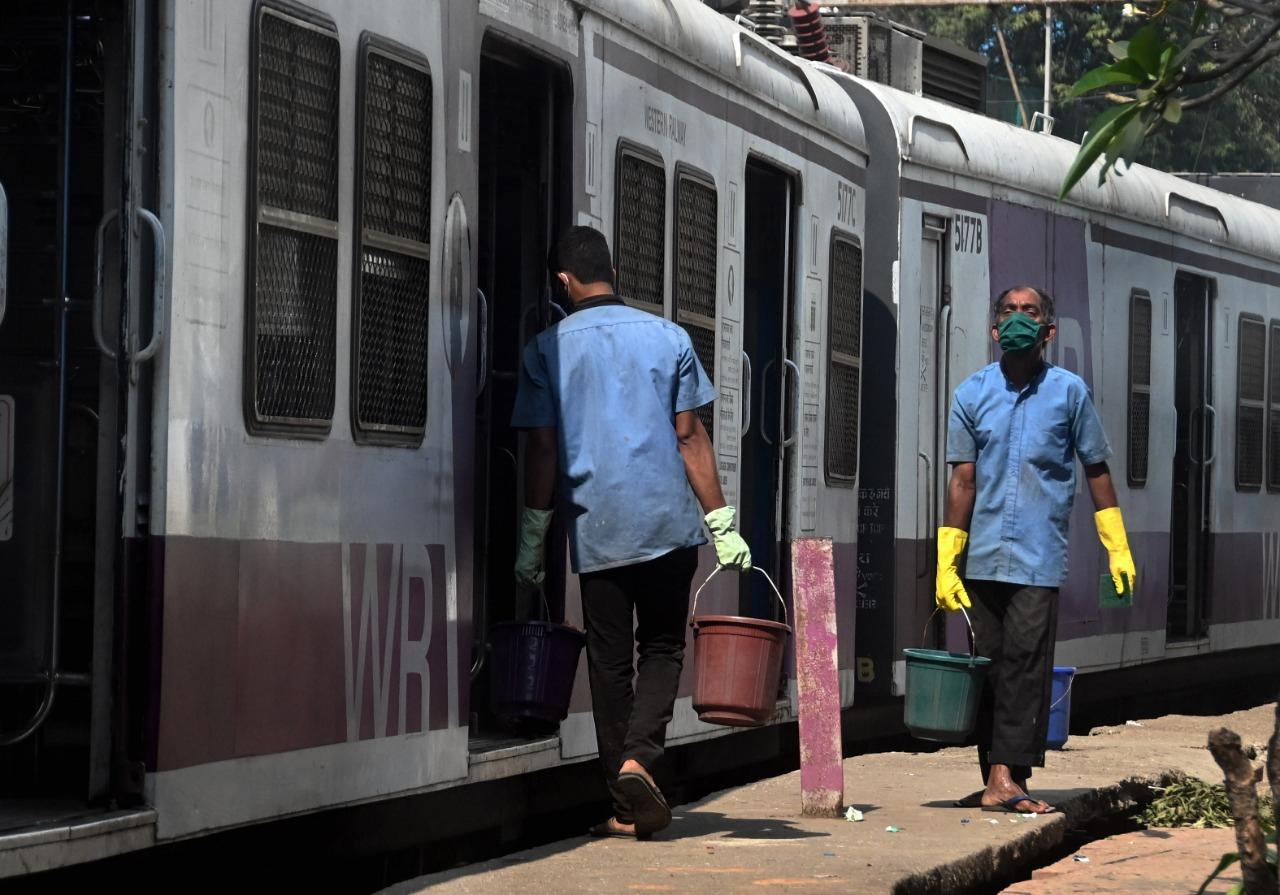 In picture: Western Railway workers carry out sanitisation of local trains as the city gears up to welcome back its lifeline.