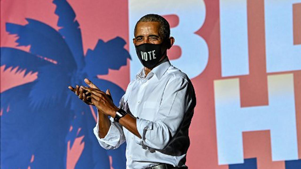 Former US President Barack Obama speaks at a drive-in rally as he campaigns for Democratic presidential candidate former Vice President Joe Biden in Miami, Florida. Pic/AFP