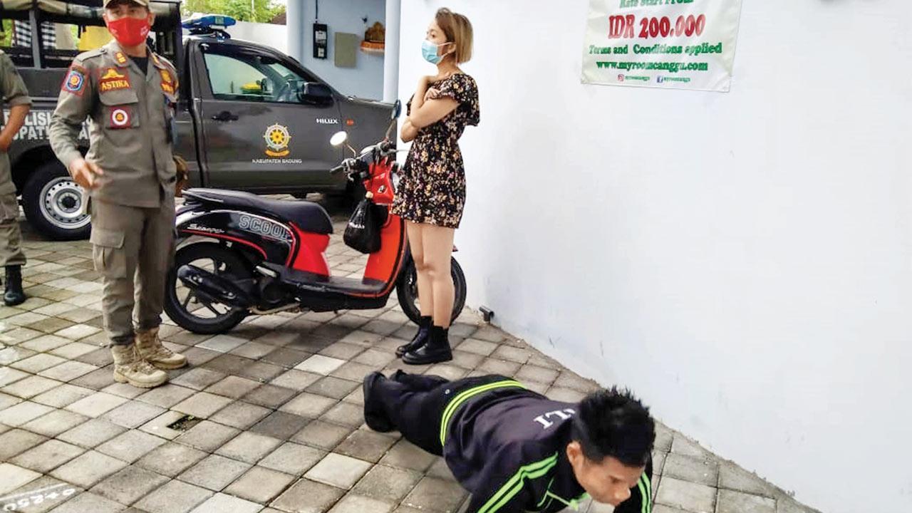 Foreigners caught not wearing masks in Indonesia's Bali asked to do 50 push-ups