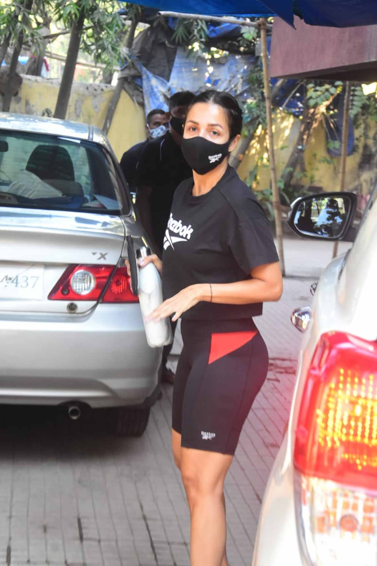 Malaika Arora was snapped at the gym wearing black athleisure during the outing. The fitness diva also waved at the paparazzi when clicked in the city. All pictures/Yogen Shah