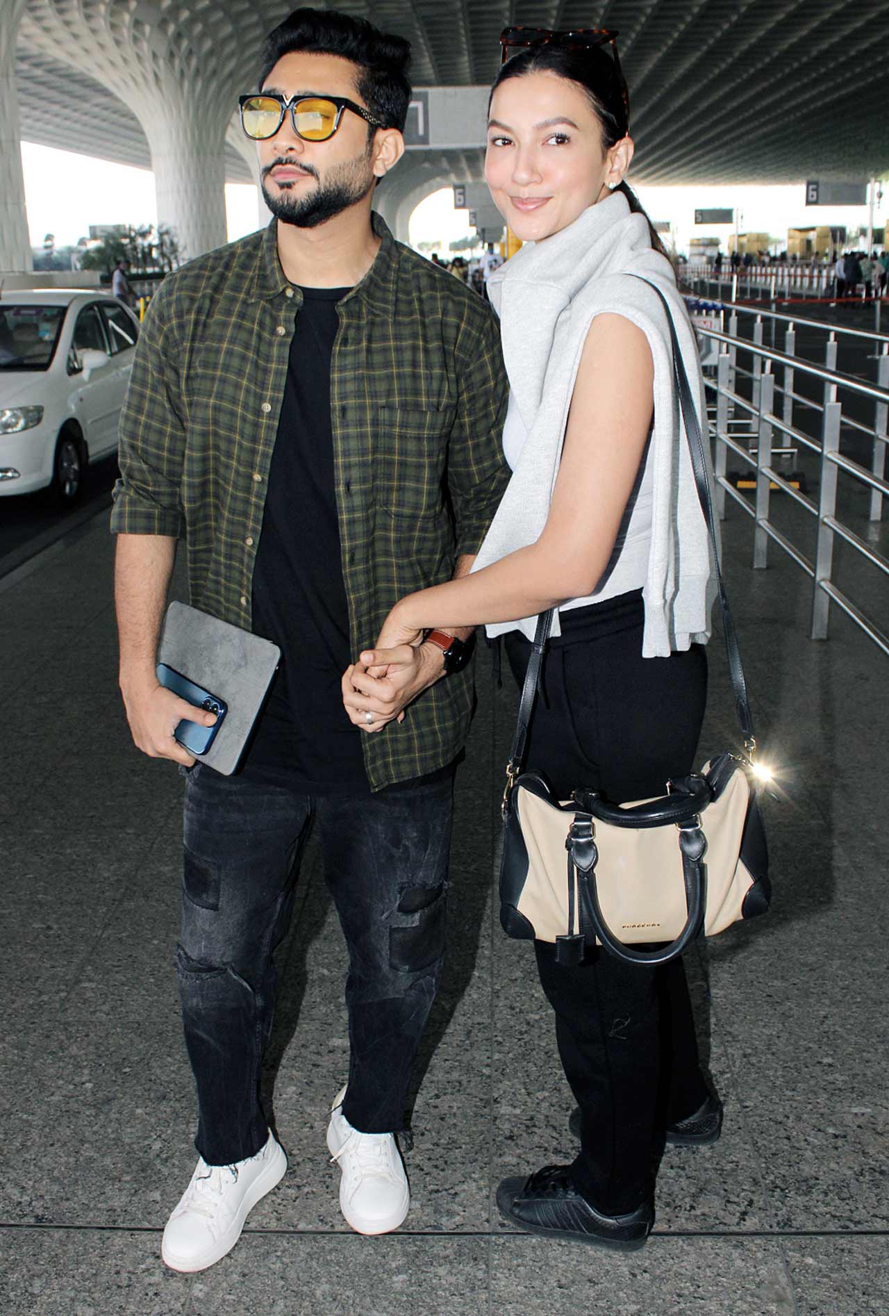 Zaid Darbar and Gauahar Khan posed for the paparazzi when snapped at the Mumbai airport. The actress was seen wearing a casual outfit, paired with a grey hoodie during the outing. All pictures/Yogen Shah