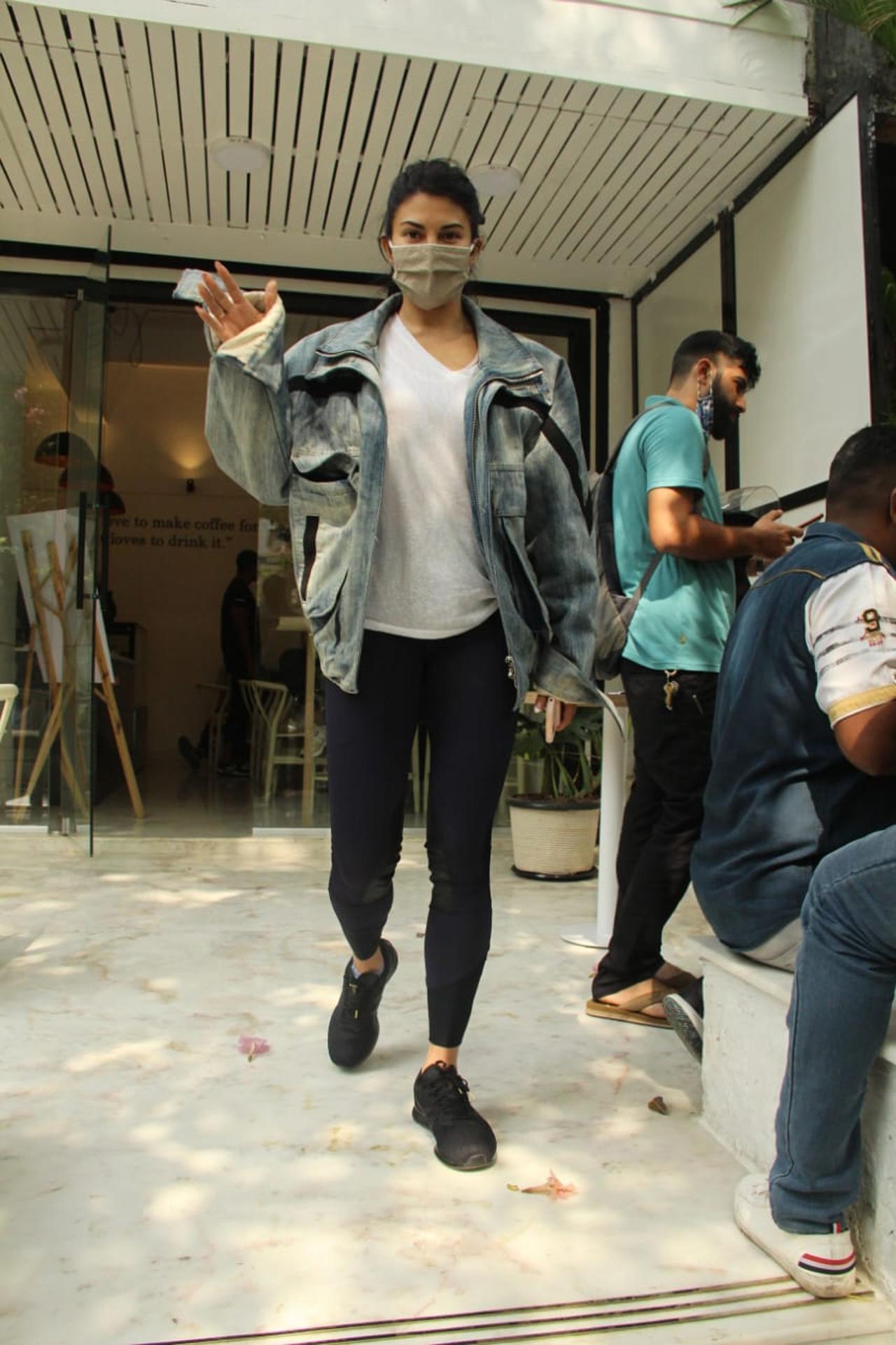 Jacqueline Fernandez was clicked outside a coffee shop in Bandra. The actress opted for a white t-shirt, over-sized denim jacket and black leggings.