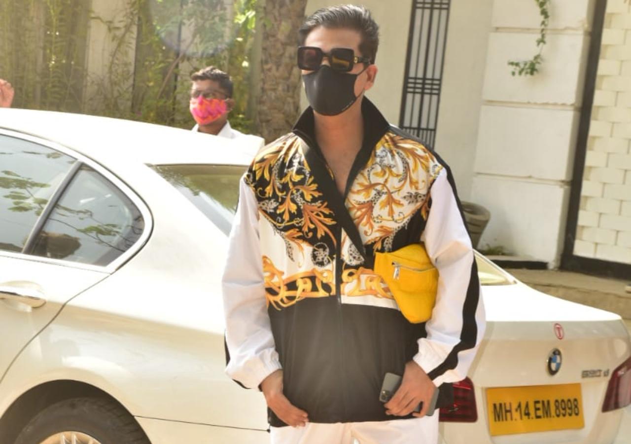 Karan Johar arrived at a venue in style. The producer-director was dressed in a white designer tracksuit with gold and black detailing. The 48-year-old star completed his look with a chunky pair of shades, and donned matching shoes.