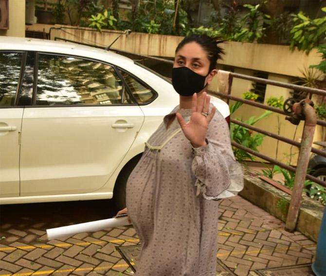 Kareena Kapoor Khan was snapped in Bandra, Mumbai. The actress, who is in her final trimester, looked pretty in a beige paternity dress, paired with her favourite pink slippers.
