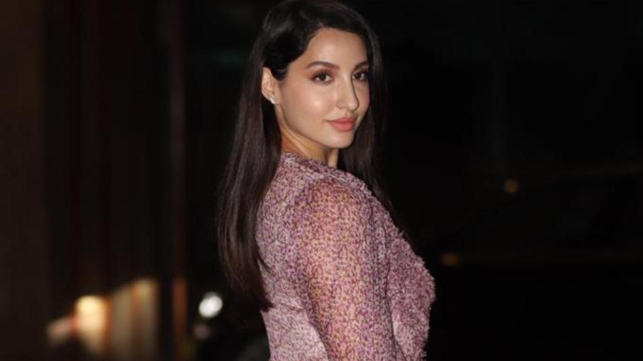 Nora Fatehi was snapped at producer Ramesh Taurani's house in Bandra. The Dilbar star opted for a purple dress that showed off her toned legs.