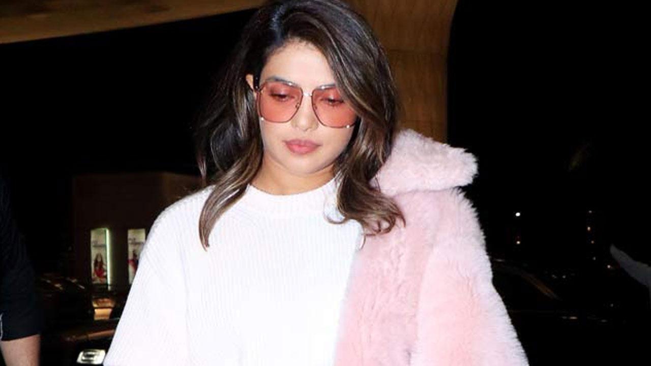 Photo Inside: Priyanka Chopra looks electrifying in a red bikini as she enjoys pool time