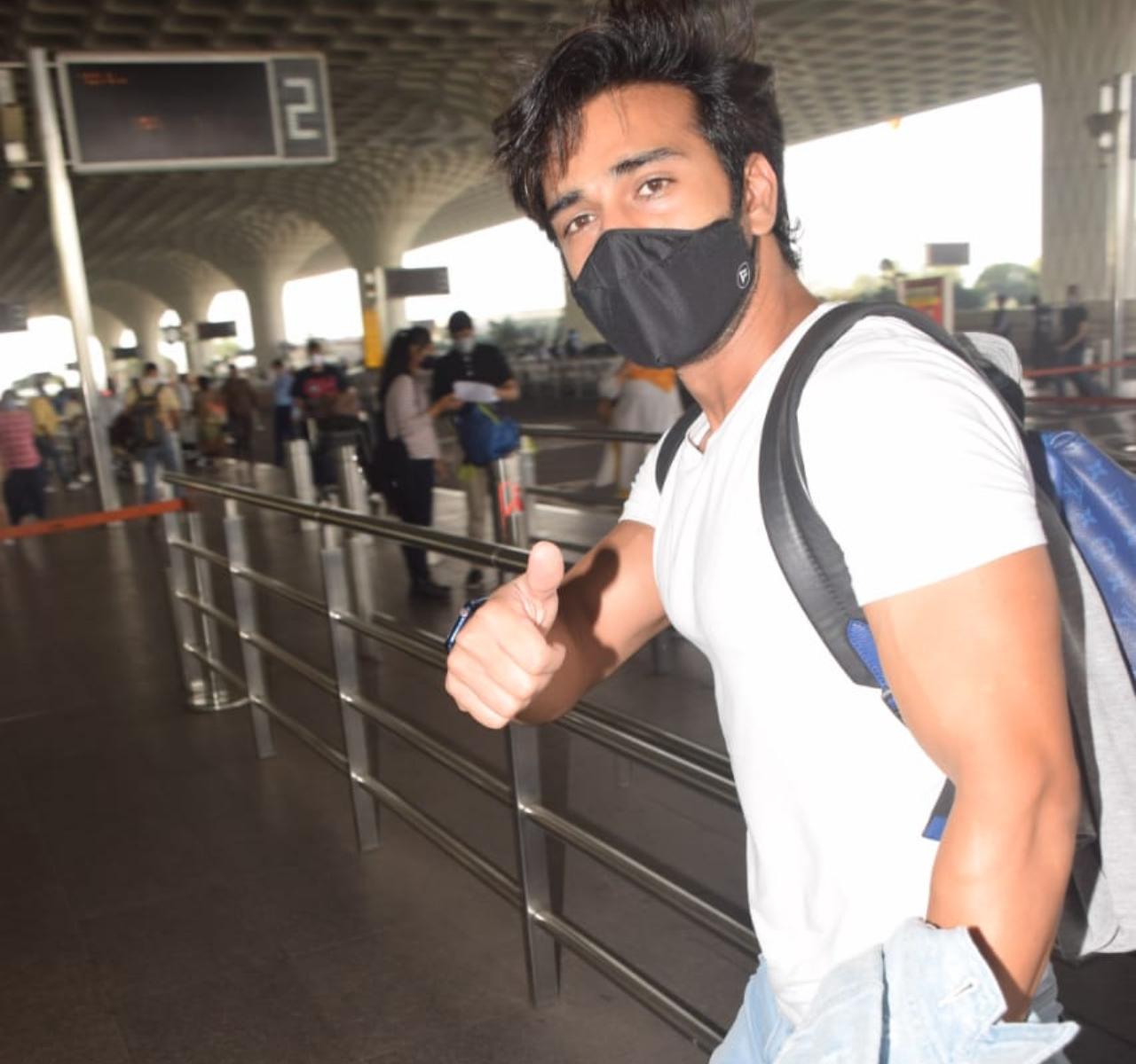 Pulkit Samrat donned a white t-shirt and pants as he was clicked at the airport. The actor wore a black protective mask.