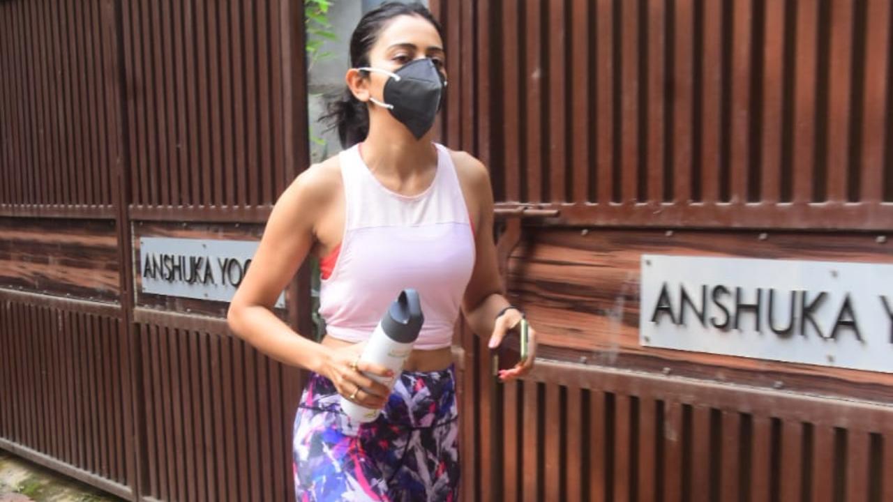 Later, Rakul was spotted at her gym. She opted for a pink crop top and purple printed leggings for her workout session.