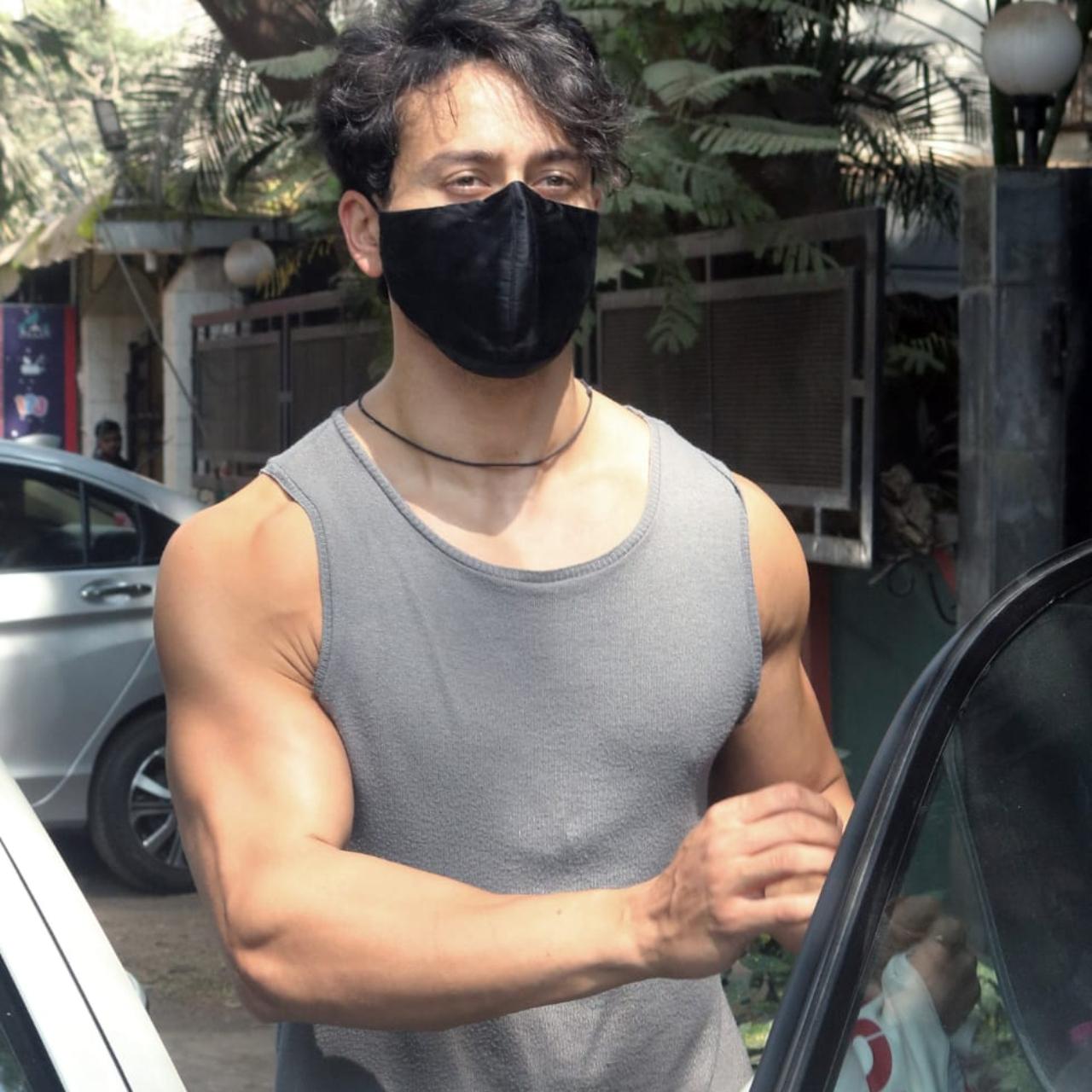 Tiger Shroff was clicked at a dubbing studio in Juhu. The actor showed off his muscles in his grey vest and green shorts.