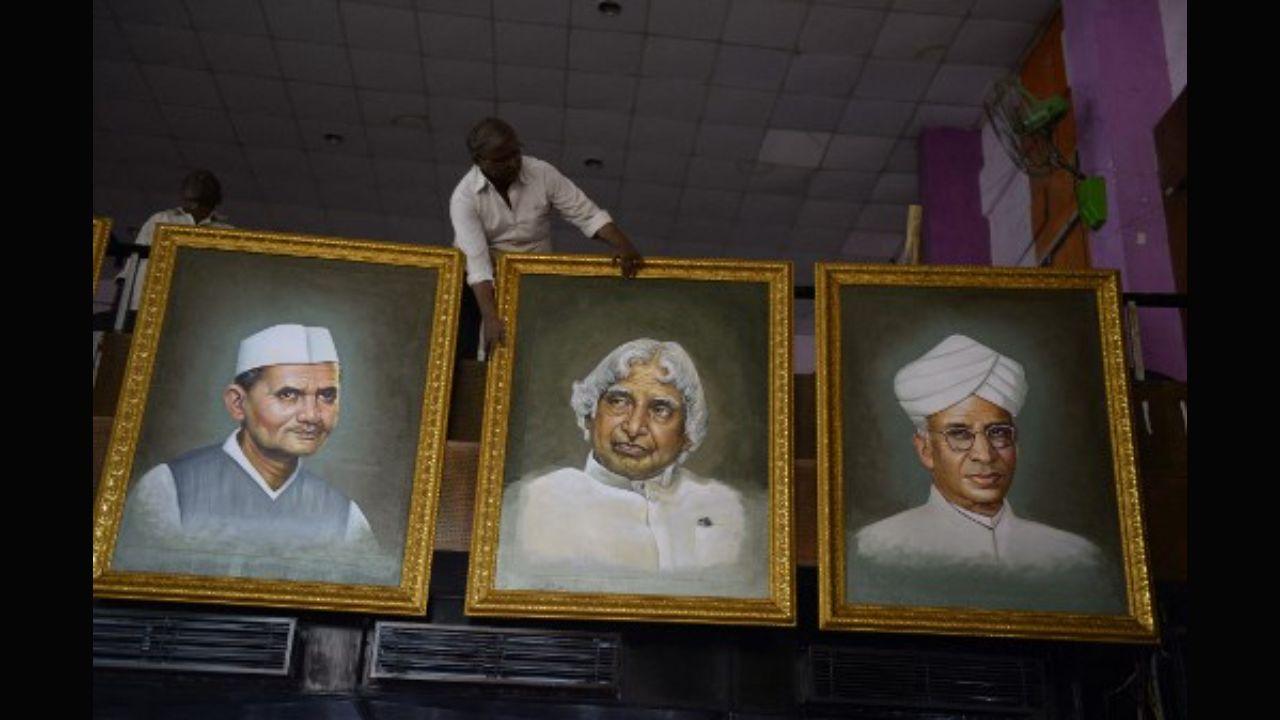 The aerospace scientist became only the third president after Dr Sarvepalli Radhakrishnan and Zakir Hussain to receive the Bharat Ratna award before they became presidents of India. Kalam received the Bharat Ratna in 1997, five years before he occupied the Rashtrapati Bhavan in 2002. In this photo, Indian artist Nageshwar Rao (top) arranges his paintings of portraits of Bharat Ratna Award winners (L-R) Lal Bahadur Shastri, APJ Abdul Kalam and Sarvepalli Radhakrishnan at the Sri Thyagaraja Gana Sabha auditorium in Hyderabad on June 28, 2018. Photo: AFP 