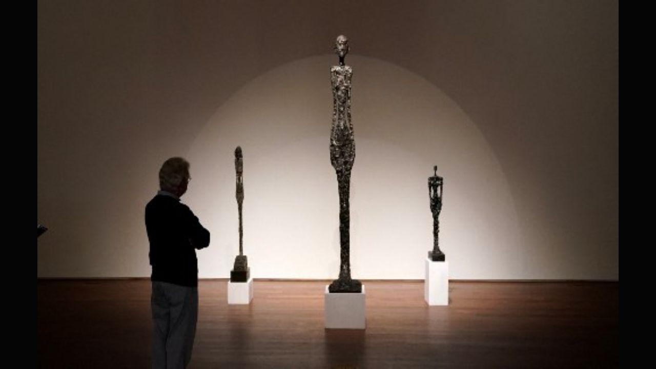 Alberto Giacometti's work in the second half of his career is characterised with thinner figures that grew taller with the next sculpture and looked life-size. A person looks at the Swiss artist's 'Grande femme I' during a press preview for a Sotheby's sale in October 2020 in New York City. Photo: AFP