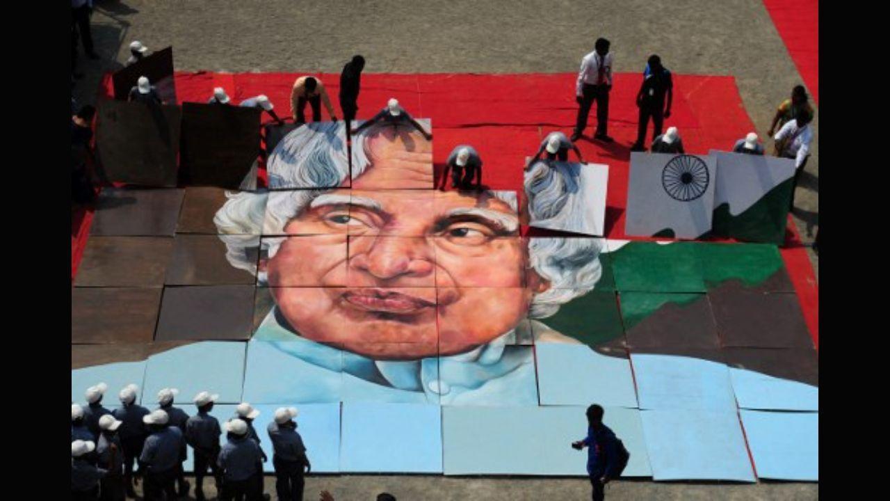 Indian school children piece together an image of former Indian president, APJ Kalam during a remembrance event on his 85th birth anniversary at a school in Chennai on October 15, 2016. Photo Courtesy: AFP   