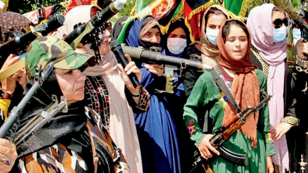 Armed Afghan women take to the streets