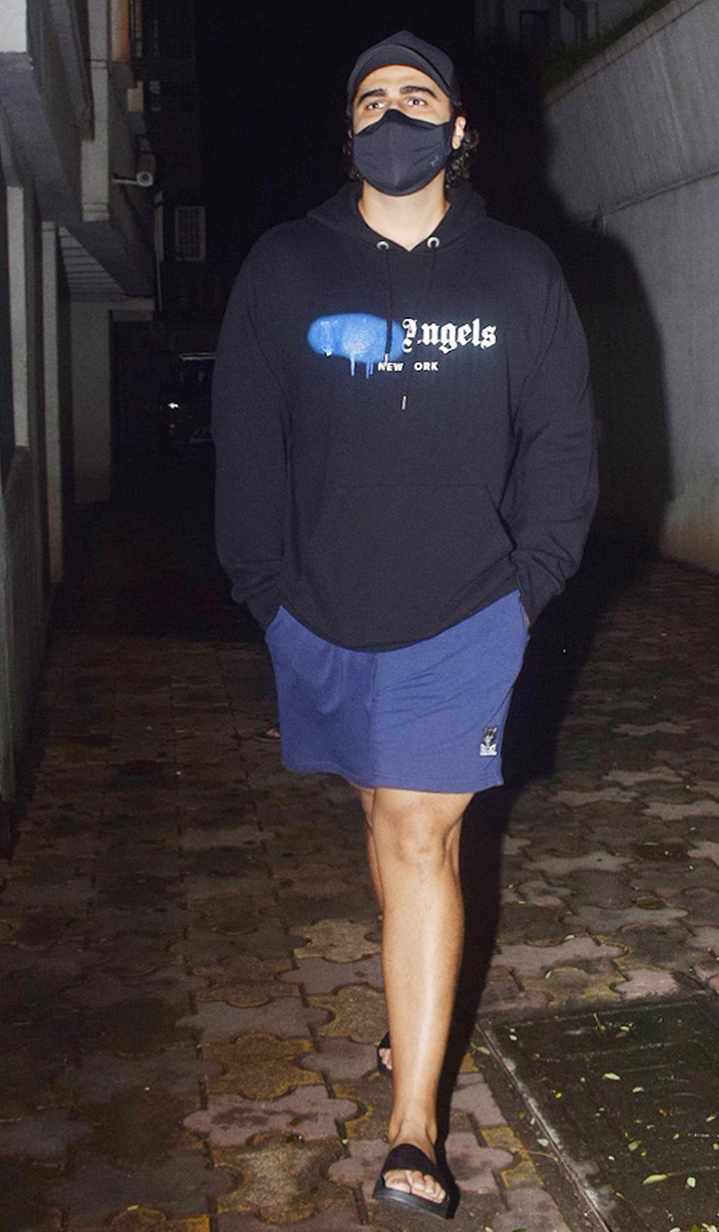 Arjun Kapoor dressed in a black tee and navy shorts as he arrived at a popular clinic in Juhu.